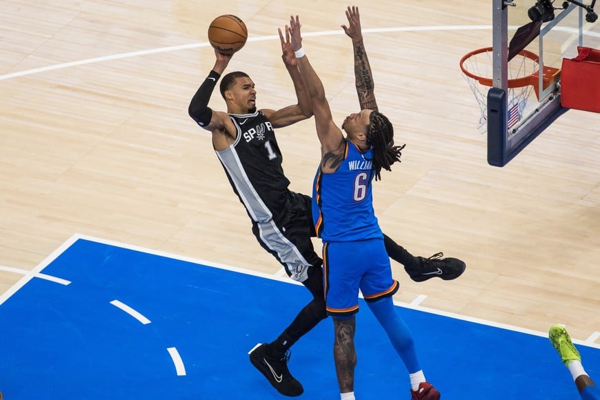 May 18, 2026; Oklahoma City, Oklahoma, USA; San Antonio Spurs center Victor Wembanyama (1) shoots while defended by Oklahoma City Thunder forward Jaylin Williams (6) in the fourth quarter during game one of the western conference finals for the 2026 NBA playoffs at Paycom Center. Mandatory Credit: Brett Rojo-Imagn Images