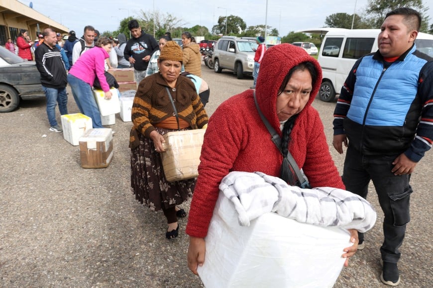 People bring products packed in boxes to Santa Cruz's Viru Viru International airport, to send to their families in the city of La Paz, due to shortages caused by roadblocks, miners' protests and a fuel crisis in the city,  which have led to food shortages, in Santa Cruz, Bolivia, May 19, 2026. REUTERS/Ipa Ibanez     TPX IMAGES OF THE DAY