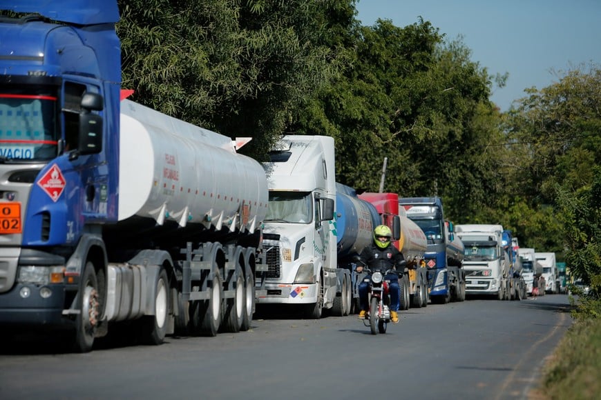 Bolivian fuel trucks wait near a fuel logistics center for conditions to stabilize in Bolivia amid escalating protests calling for the resignation of Bolivian President Rodrigo Paz, in San Antonio, Paraguay, May 19, 2026.REUTERS/Cesar Olmedo