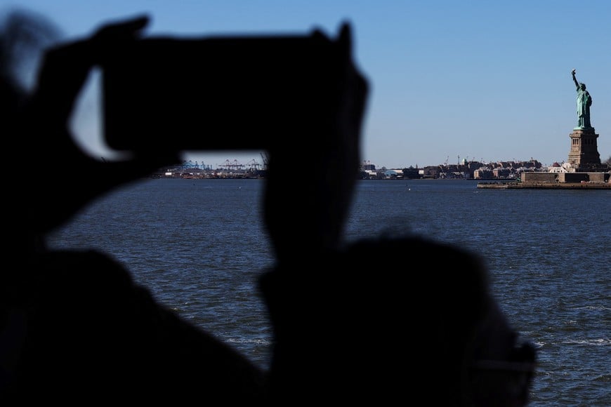 The Statue of Liberty is seen from aboard the Staten Island Ferry in New York City, U.S., March 18, 2025. REUTERS/Shannon Stapleton
