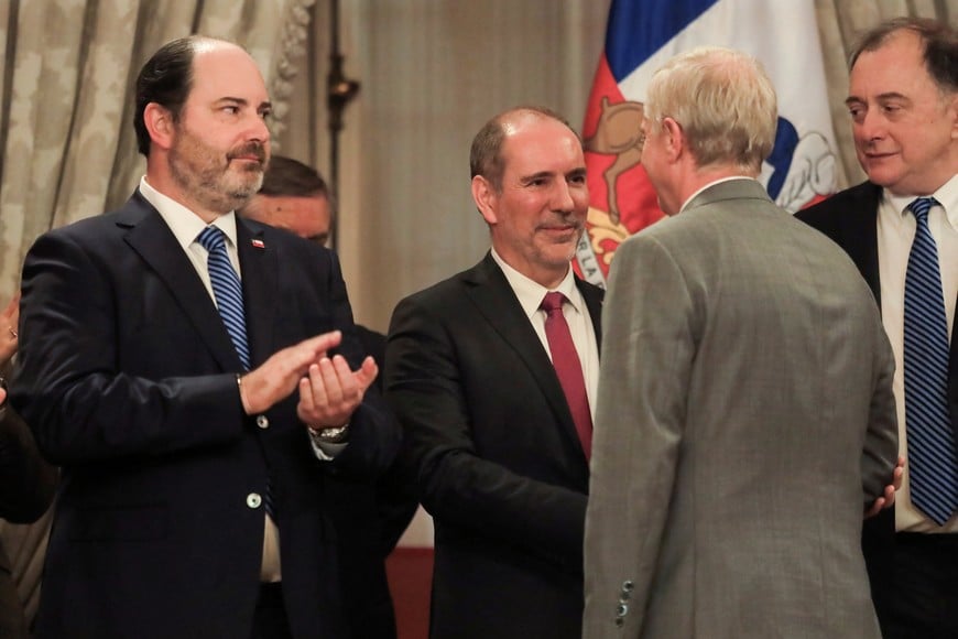 Louis de Grange, who was appointed as Chile's new public works minister, shakes hands with Chilean President Jose Antonio Kast on they day of a cabinet shuffle announcement at La Moneda Presidential Palace in Santiago, Chile, May 19, 2026. REUTERS/Diego Reyes