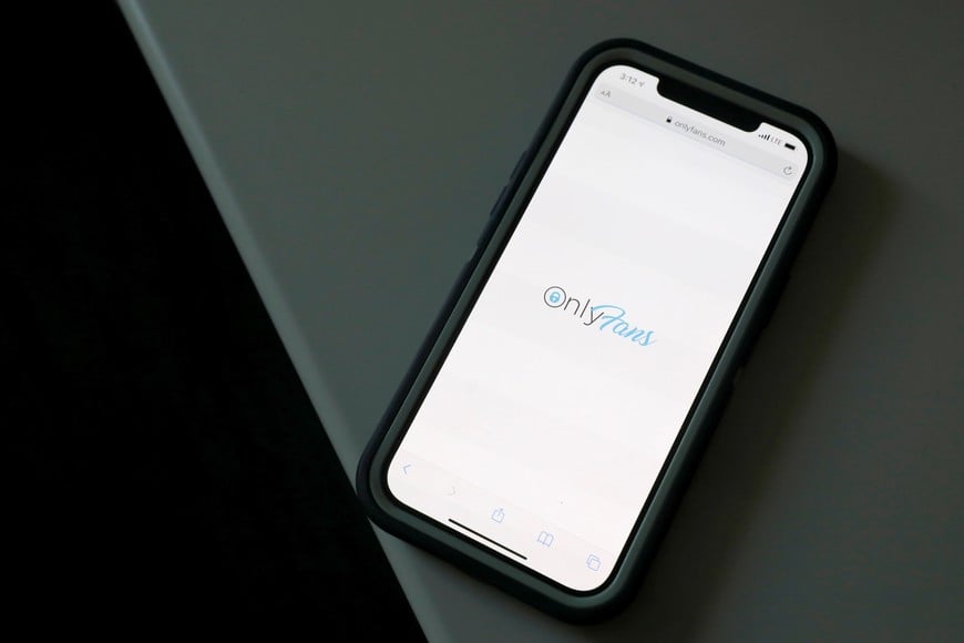 The logo for OnlyFans is seen on a device in this photo illustration in Manhattan, New York City, U.S., August 19, 2021. REUTERS/Andrew Kelly