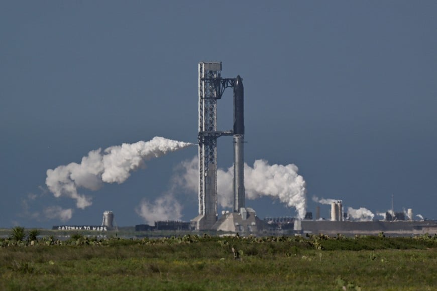 The SpaceX Starship spacecraft, about to start fueling, sits atop the Super Heavy Booster, ahead of the 12th test flight of the Starship spacecraft in Starbase, Texas, U.S., May 21, 2026. REUTERS/Steve Nesius