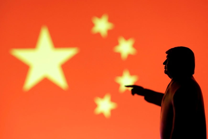 FILE PHOTO: A 3D-printed miniature model depicting U.S. President Donald Trump, Chinese flag in this illustration taken, April 17, 2025. REUTERS/Dado Ruvic/Illustration/File Photo