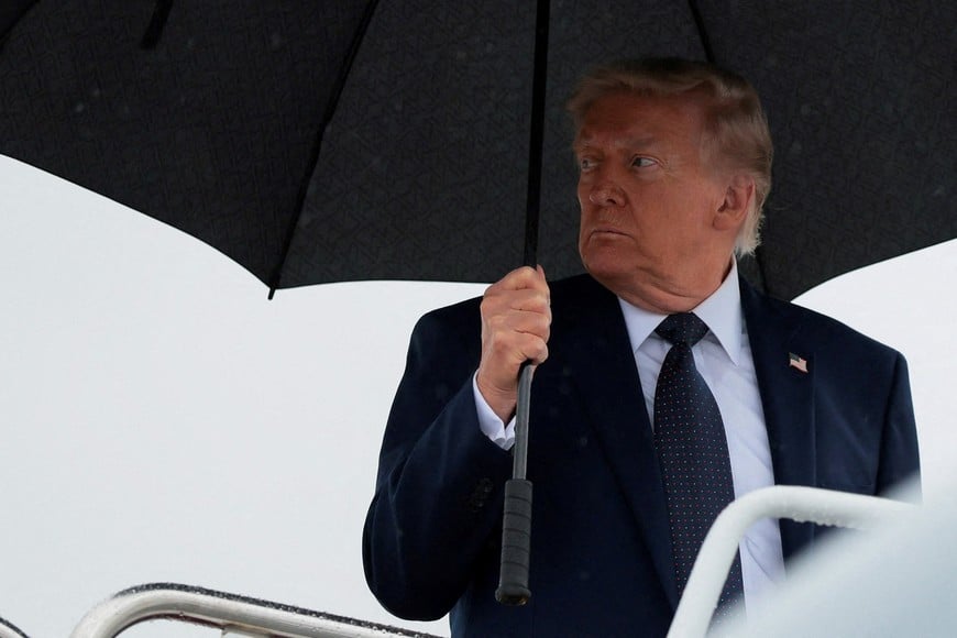 U.S. President Donald Trump looks on as he boards Air Force One en route to Morristown Airport in Morristown, New Jersey, at Joint Base Andrews, Maryland, U.S., May 22, 2026. REUTERS/Kylie Cooper     TPX IMAGES OF THE DAY