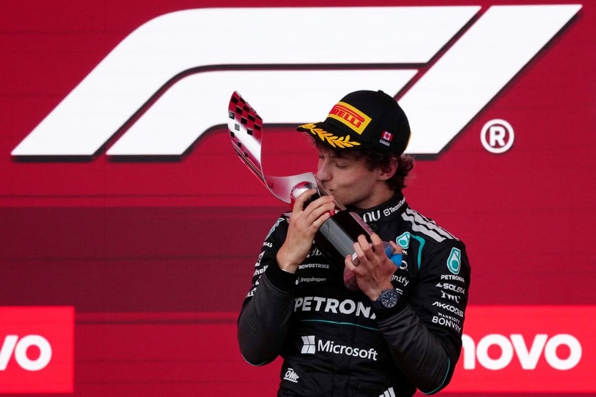 Formula One F1 - Canadian Grand Prix - Circuit Gilles Villeneuve, Montreal, Quebec, Canada - May 24, 2026
Mercedes' Andrea Kimi Antonelli celebrates on the podium with a trophy after winning the Canadian Grand Prix REUTERS/Mathieu Belanger