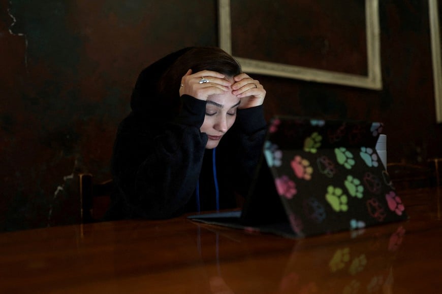 An Iranian woman, Samaneh, reacts as she tries to connect to the internet to check on her visa status for her migration process, after a nationwide internet shutdown since January 8, 2026, following Iran's protests, in Tehran, Iran, January 25, 2026. Majid Asgaripour/WANA (West Asia News Agency) via REUTERS ATTENTION EDITORS - THIS PICTURE WAS PROVIDED BY A THIRD PARTY TPX IMAGES OF THE DAY
