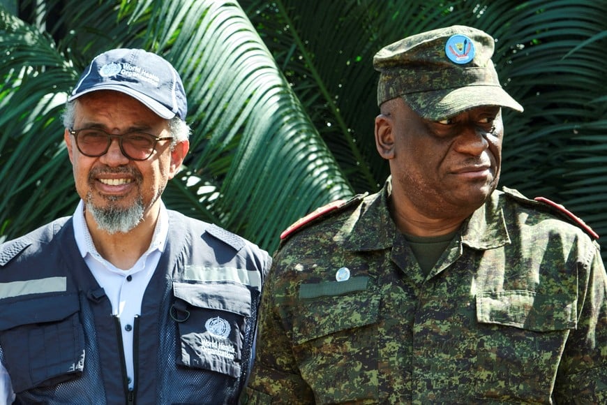 Director-General of the World Health Organisation (WHO) Tedros Adhanom Ghebreyesus meets Lieutenant-General Johnny Luboya Nkashama the military governor of Ituri Province as he arrives, to coordinate the response to the Ebola outbreak, as agencies intensify efforts to contain a new Ebola outbreak caused by the Bundibugyo virus strain, at the Bunia National Airport in Bunia, Ituri province, Democratic Republic of Congo, May 30, 2026. REUTERS/Gradel Muyisa Mumbere
