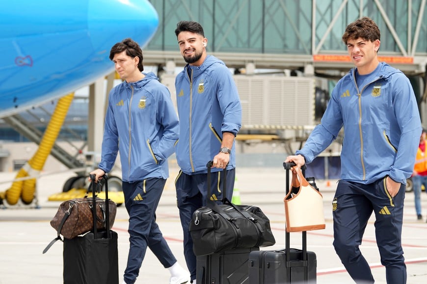 May 31, 2026; Kansas City, Missouri, USA; Leonardo Balderi, Jose Manuel Lopez (center), and Julian Alvarez (right) of Argentina arrive for the 2026 FIFA World Cup at Kansas City International Airport. Mandatory Credit: Denny Medley-Imagn Images