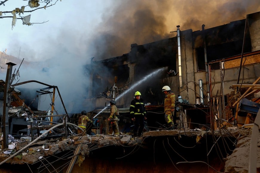 FILE PHOTO: Firefighters work at the site of a car repair workshop damaged during Russian missile and drone strikes, amid Russia's attack on Ukraine, in Kyiv, Ukraine June 2, 2026. REUTERS/Valentyn Ogirenko/File Photo