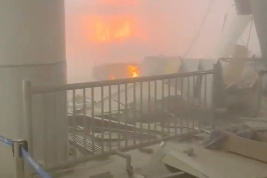 Debris lies on the floor as fire burns in the background, in the aftermath of Iranian strikes, according to the foreign ministry, at Kuwait International Airport in Kuwait City, Kuwait, June 3, 2026, in this still image obtained from a social media video.  Social Media/via REUTERS  THIS IMAGE HAS BEEN SUPPLIED BY A THIRD PARTY. NO RESALES. NO ARCHIVES.

VERIFICATION: 
Roof structure, columns, and interior of airport terminal matched archive and satellite imagery and verified corroborating visuals.
Date verified by statement from Kuwait's foreign ministry that one person was killed in an Iranian attack targeting civilian facilities in Kuwait, including the international airport and diplomatic missions.