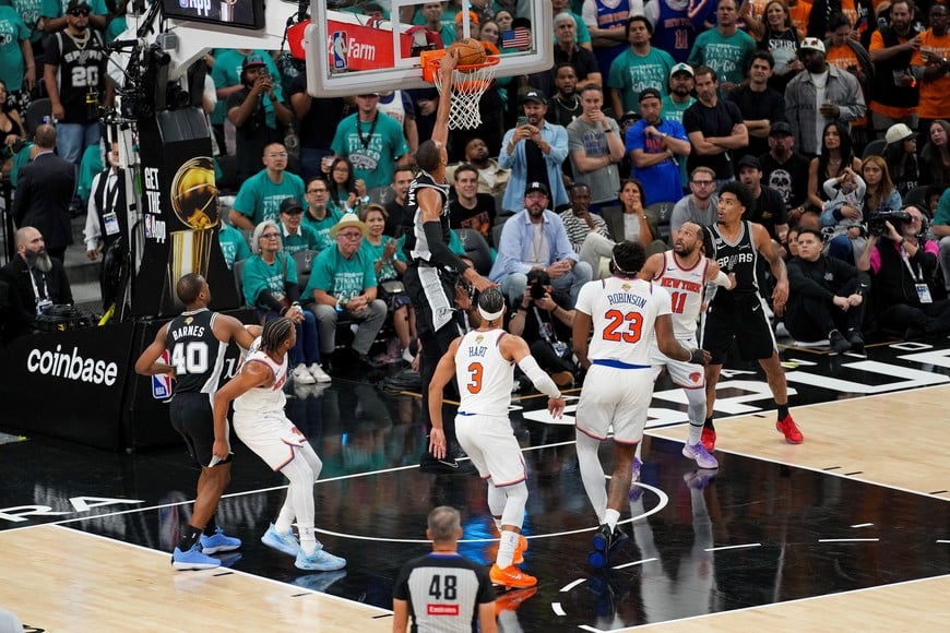 Jun 3, 2026; San Antonio, Texas, USA; San Antonio Spurs forward Victor Wembanyama (1) dunks the ball against the New York Knicks during the fourth quarter during game one of the 2026 NBA Finals at Frost Bank Center. Mandatory Credit: Daniel Dunn-Imagn Images