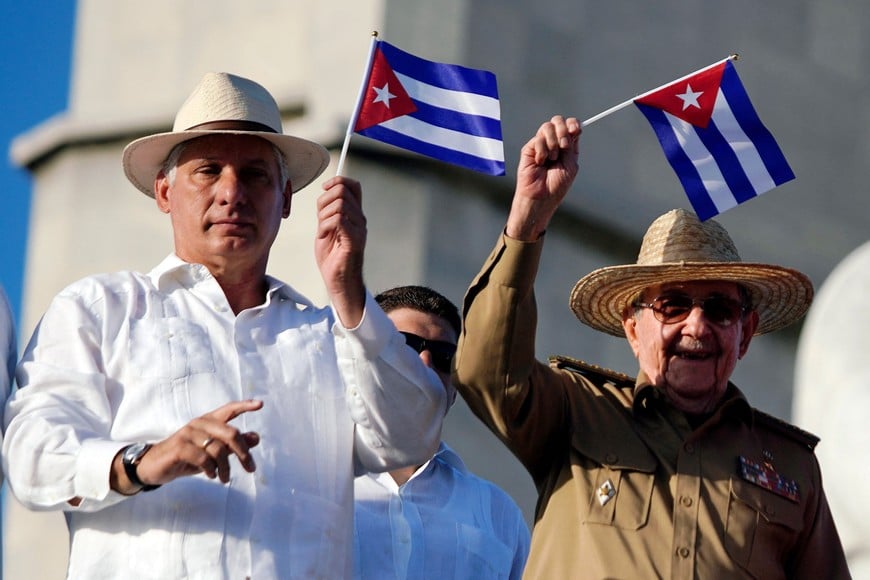 FILE PHOTO: Cuba's First Secretary of the Communist Party and former President Raul Castro and Cuba's President Miguel Diaz-Canel watch the May Day rally in Havana, Cuba May 1, 2019. REUTERS/Alexandre Meneghini/File Photo