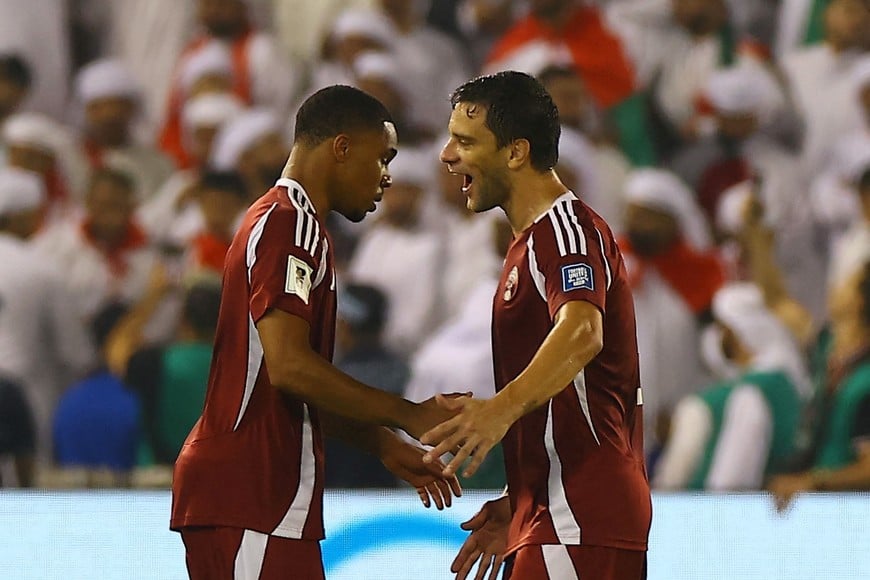 Soccer Football - FIFA World Cup - AFC Qualifiers - Group A - Qatar v United Arab Emirates - Jassim Bin Hamad Stadium, Doha, Qatar - October 14, 2025
Qatar's Pedro Miguel celebrates scoring their second goal with Lucas Mendes REUTERS/Ibraheem Al Omari