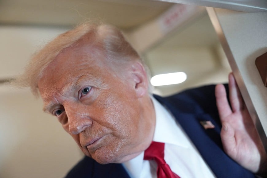 U.S. President Donald Trump looks on as he speaks to members of the media on board Air Force One while flying from Joint Base Andrews to Chippewa Valley Regional Airport in Eau Claire, Wisconsin, U.S., June 5, 2026. REUTERS/Nathan Howard