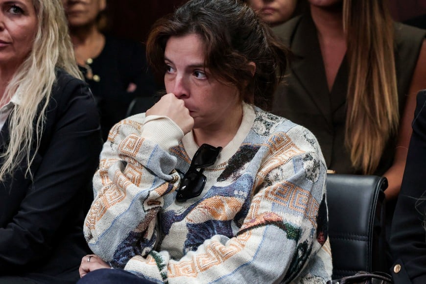 Dalma Maradona, daughter of late Argentine soccer legend Diego Armando Maradona, sits inside a court to attend a new trial against medical professionals facing accusations of negligence in connection to the 2020 death of the global icon, in Buenos Aires, Argentina, April 14, 2026. REUTERS/Cristina Sille