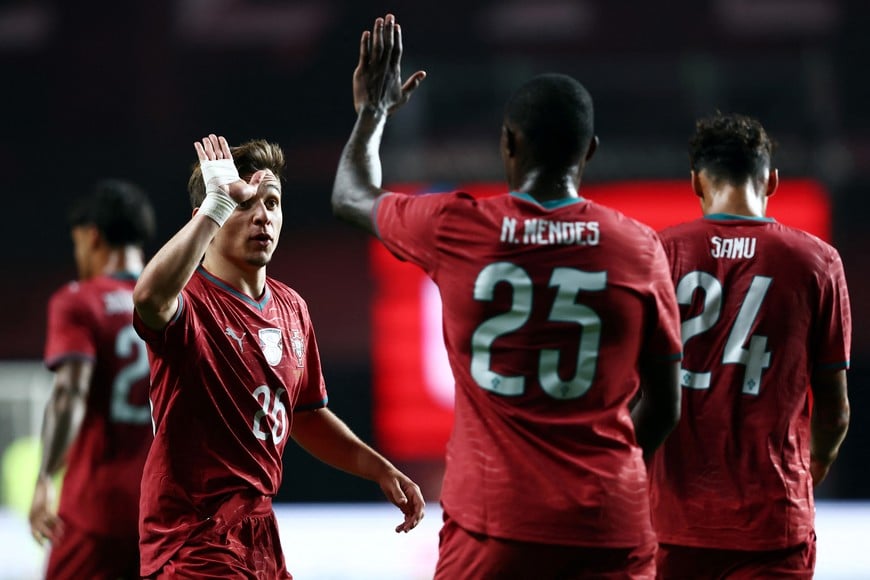 Soccer Football - International Friendly - Portugal v Nigeria - Estadio Dr. Magalhaes Pessoa, Leiria, Portugal - June 10, 2026
Portugal's Francisco Conceicao celebrates scoring their second goal with Nuno Mendes and Samu Costa REUTERS/Rodrigo Antunes