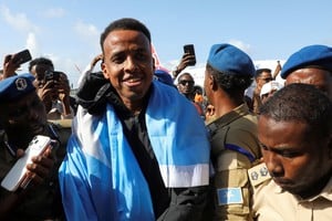 Somali referee Omar Abdulkadir Artan, who had been expected to officiate at matches during the 2026 FIFA World Cup but was denied entry to the United States, is received as he arrives at the Aden Abdulle Osman International Airport in Mogadishu, Somalia June 10, 2026. REUTERS/Feisal Omar