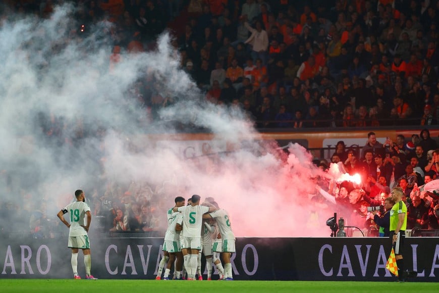 Soccer Football - International Friendly - Netherlands v Algeria - De Kuip, Rotterdam, Netherlands - June 3, 2026
Algeria's Anis Hadj Moussa celebrates scoring their first goal with teammates and fans with flares REUTERS/Piroschka Van De Wouw