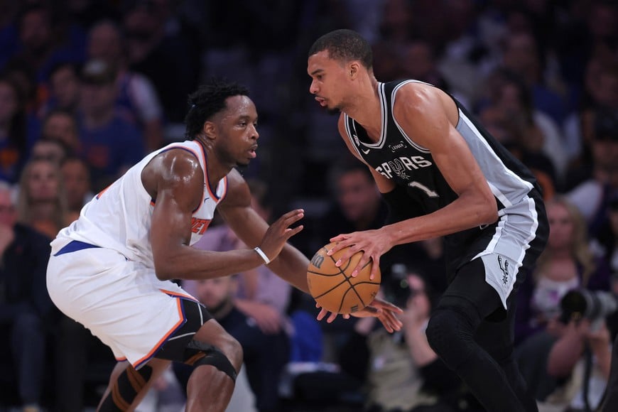 Jun 10, 2026; New York, New York, USA; San Antonio Spurs forward Victor Wembanyama (1) controls the ball against New York Knicks forward Og Anunoby (8) in the second quarter during game four of the 2026 NBA Finals at Madison Square Garden. Mandatory Credit: Brad Penner-Imagn Images