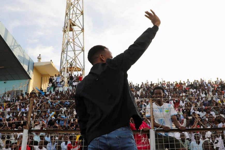 Somali referee Omar Abdulkadir Artan, who was expected to officiate at matches during the 2026. FIFA World Cup but was denied entry to U.S., waves towards fans at the Mogadishu stadium, in Mogadishu, Somalia, June 10, 2026. REUTERS/Feisal Omar
