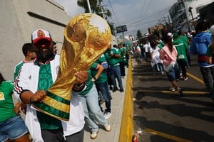 Soccer Football - FIFA World Cup 2026 - Group A - Mexico v South Africa - Estadio Azteca, Mexico City, Mexico - June 11, 2026
A Mexico fan displays a giant replica of the World Cup trophy outside the stadium before the match REUTERS/Kai Pfaffenbach