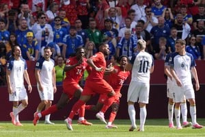 Soccer Football - FIFA World Cup 2026 - Group B - Canada v Bosnia and Herzegovina - Toronto Stadium, Toronto, Canada - June 12, 2026
Canada's Cyle Larin celebrates scoring their first goal with Promise David and Ali Ahmed IMAGN IMAGES via Reuters/John Sokolowski