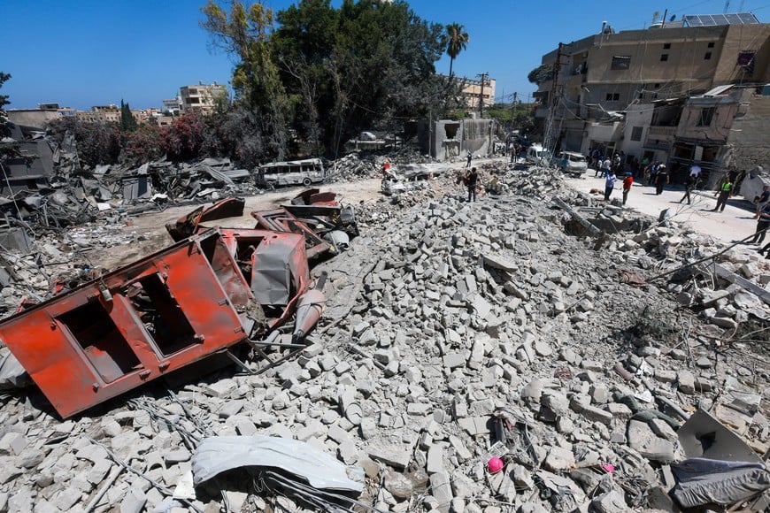 People gather at the site an Israeli strike in Tyre, Lebanon, June 12, 2026. REUTERS/Aziz Taher