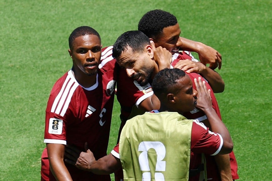 Soccer Football - FIFA World Cup 2026 - Group B - Qatar v Switzerland - San Francisco Bay Area Stadium, Santa Clara, California, U.S. - June 13, 2026
Qatar's Boualem Khoukhi celebrates scoring their first goal with teammates REUTERS/Eloisa Lopez