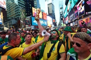 Soccer Football - FIFA World Cup 2026 - USA v Paraguay - Fans gather in New York - New York, U.S. - June 12, 2026
Brazil fans with a loudspeaker and replica FIFA World Cup trophy in Times Square ahead of the match IMAGN IMAGES via Reuters/Vincent Carchietta