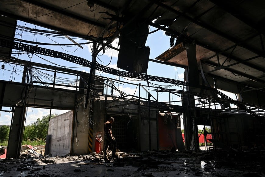 A police expert works at the site of a postal distribution centre of Nova Post company hit by a Russian drone strike, amid Russia's attack on Ukraine, in Zaporizhzhia, Ukraine June 12, 2026. REUTERS/Stringer