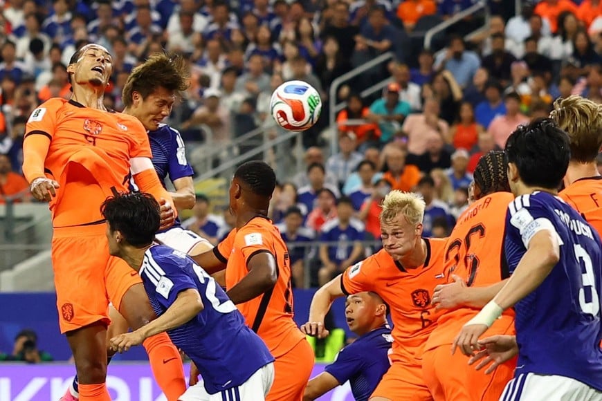 Soccer Football - FIFA World Cup 2026 - Group F - Netherlands v Japan - Dallas Stadium, Arlington, Texas, U.S. - June 14, 2026
Japan's Koki Ogawa heads the ball before Daichi Kamada scores their second goal REUTERS/Hannah Mckay