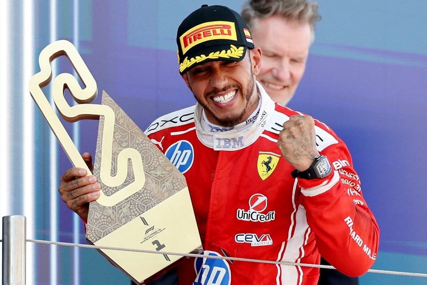 Formula One F1 - Barcelona-Catalunya Grand Prix - Circuit de Barcelona-Catalunya, Barcelona, Spain - June 14, 2026
Ferrari's Lewis Hamilton celebrates with the trophy after winning the Barcelona-Catalunya Grand Prix REUTERS/Nacho Doce     TPX IMAGES OF THE DAY