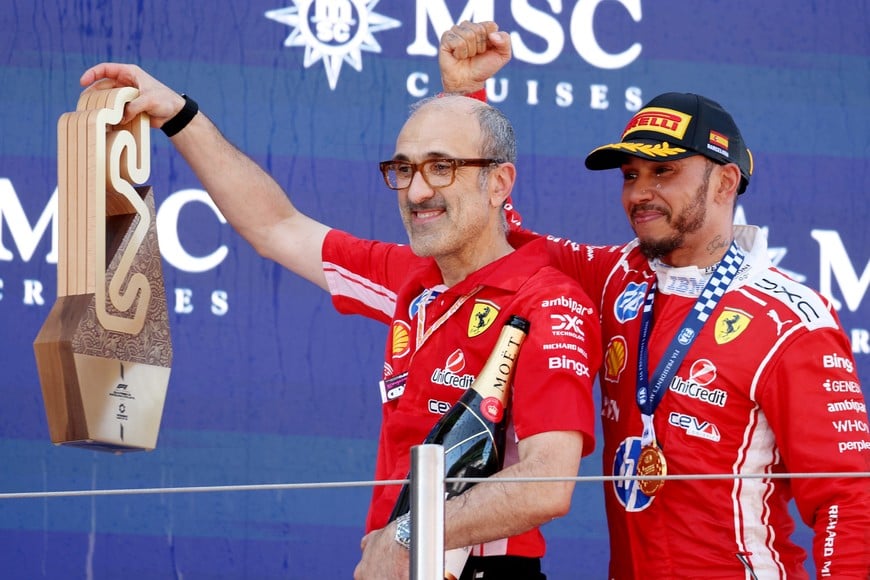 Formula One F1 - Barcelona-Catalunya Grand Prix - Circuit de Barcelona-Catalunya, Barcelona, Spain - June 14, 2026
Ferrari's Lewis Hamilton celebrates with race engineer Carlo Santi and a trophy after winning the Barcelona-Catalunya Grand Prix REUTERS/Bruna Casas