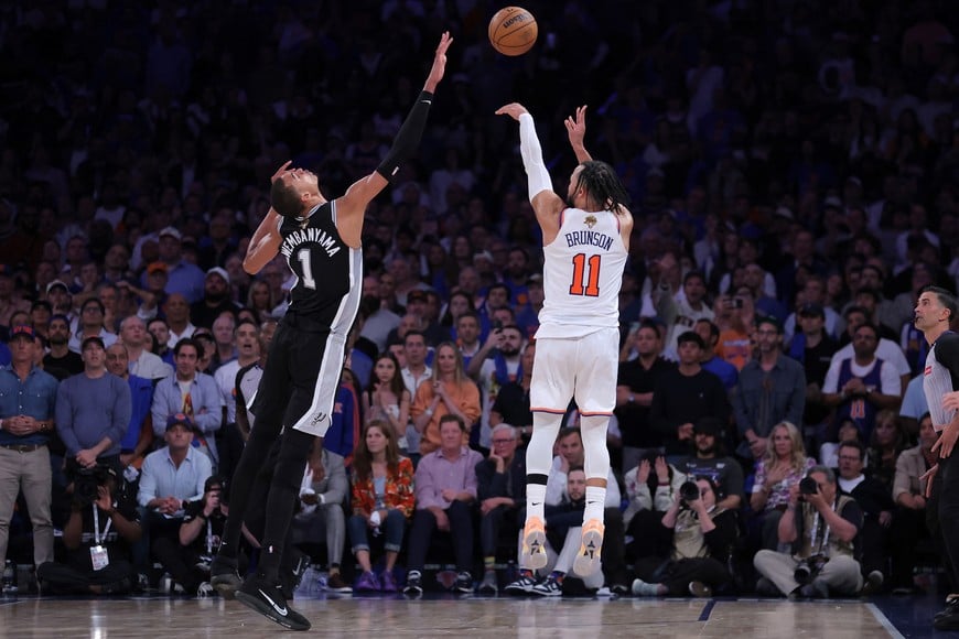 Jun 10, 2026; New York, New York, USA; New York Knicks guard Jalen Brunson (11) shoots against San Antonio Spurs forward Victor Wembanyama (1) in the fourth quarter during game four of the 2026 NBA Finals at Madison Square Garden. Mandatory Credit: Brad Penner-Imagn Images