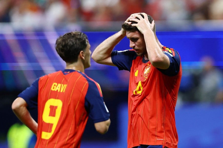 Soccer Football - FIFA World Cup 2026 - Group H - Spain v Cape Verde - Atlanta Stadium, Atlanta, Georgia, U.S. - June 15, 2026
Spain's Aymeric Laporte and Gavi react REUTERS/Claudia Greco TPX IMAGES OF THE DAY