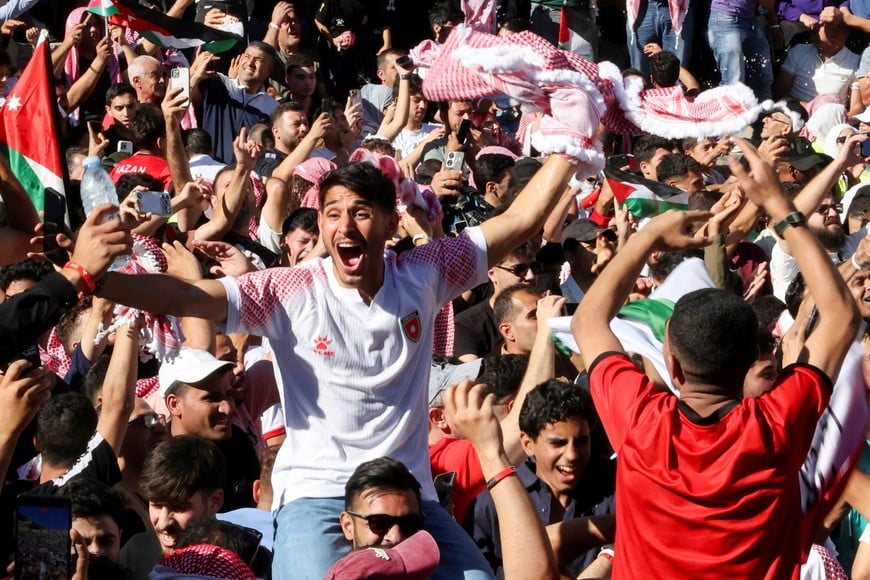 Jordanians celebrate after Jordan scores a goal during the FIFA World Cup 2026 Group J match between Jordan and Austria, as they watch the match on a screen at the Roman Theatre in Amman, Jordan, June 17, 2026. REUTERS/Alaa Al Sukhni