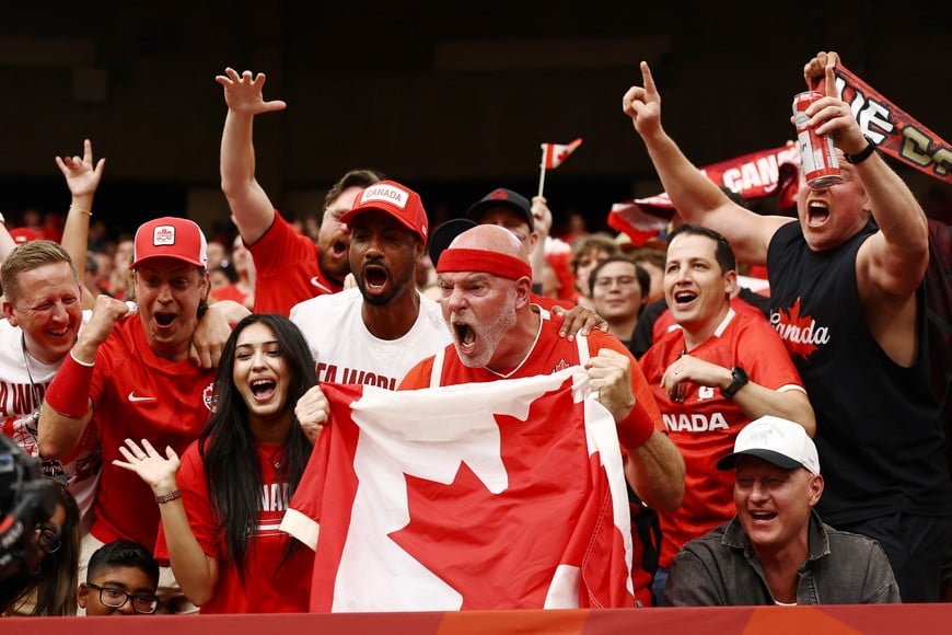 Soccer Football - FIFA World Cup 2026 - Group B - Canada v Qatar - BC Place, Vancouver, Canada - June 18, 2026
Canada fans celebrate after Jonathan David scored their sixth goal to complete his hat-trick REUTERS/Lee Smith