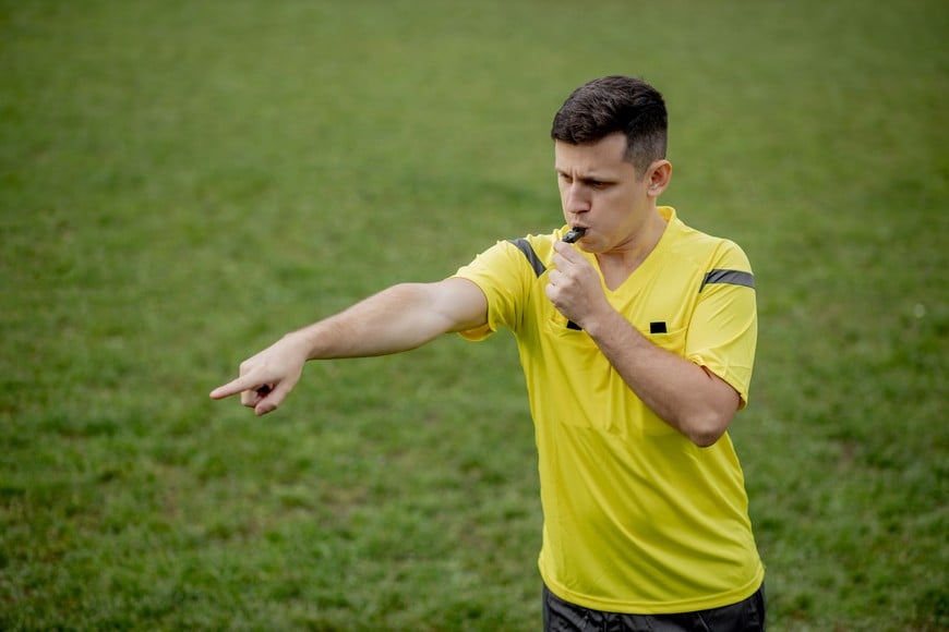 Referee showing on penalty while gaming. Concept of sport, rules violation, controversial issues, obstacles overcoming