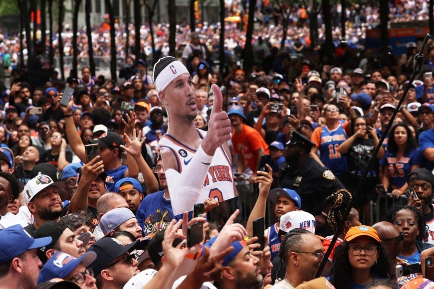 Basketball - NBA - New York Knicks Parade - New York City, New York, U.S. - June 18, 2026
New York Knicks fans celebrate with a banner of New York Knicks' Josh Hart during the parade REUTERS/Shannon Stapleton