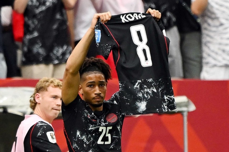 Soccer Football - FIFA World Cup 2026 - Group B - Canada v Qatar - BC Place, Vancouver, Canada - June 18, 2026
Canada's Nathan Saliba holds up the shirt of injured player Ismael Kone as he celebrates scoring their fourth goal IMAGN IMAGES via Reuters/Anne-Marie Sorvin