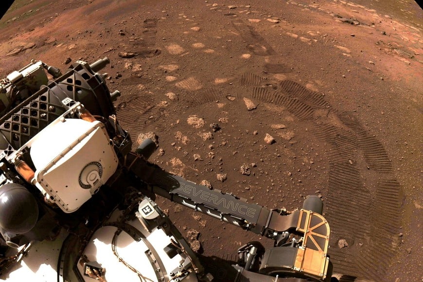 FILE PHOTO: Wheel tread marks are left in the soil of Jezero Crater on Mars, as NASA's Mars rover Perseverance drives on Martian surface for the first time, in this March 4, 2021 image supplied to Reuters. Image taken March 4, 2021. NASA/JPL-Caltech/Handout via REUTERS MANDATORY CREDIT. THIS IMAGE HAS BEEN SUPPLIED BY A THIRD PARTY. MANDATORY CREDIT./File Photo