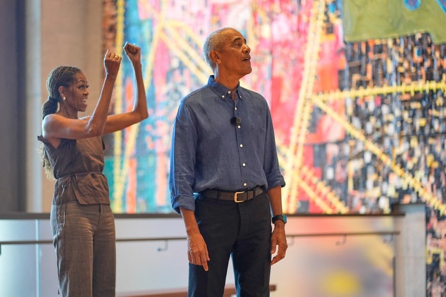 Former U.S. President Barack Obama and former first lady Michelle Obama greet the first group of visitors at the official opening of the Obama Presidential Center in Chicago, Friday, June 19, 2026. Pablo Martinez Monsivais/Pool via REUTERS