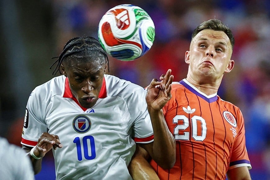 Soccer Football - FIFA World Cup 2026 - Group C - Haiti v Scotland - Boston Stadium, Foxborough, Massachusetts, U.S. - June 13, 2026?Haiti's Jean-Ricner Bellegarde in action with Scotland's Lawrence Shankland REUTERS/Peter Cziborra TPX IMAGES OF THE DAY SEARCH "WORLD CUP DAILY ONE" FOR THIS STORY. SEARCH "WIDER IMAGE" FOR ALL STORIES.