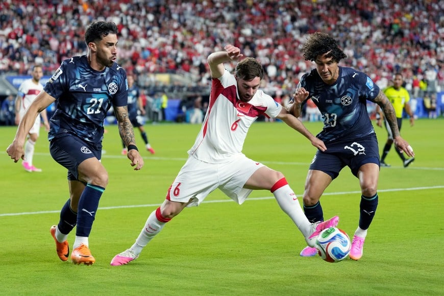 Soccer Football - FIFA World Cup 2026 - Group D - Turkey v Paraguay - San Francisco Bay Area Stadium, Santa Clara, California, U.S. - June 19, 2026
Turkey's Orkun Kokcu in action with Paraguay's Gabriel Avalos and Jose Canale IMAGN IMAGES via Reuters/Darren Yamashita