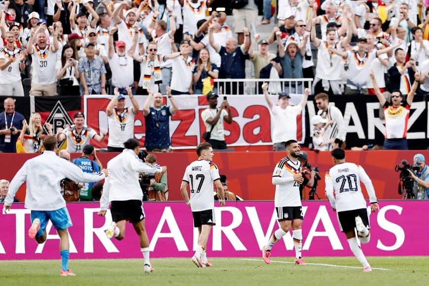 Soccer Football - FIFA World Cup 2026 - Group E - Germany v Ivory Coast - Fans gather in Toronto - Toronto, Canada - June 20, 2026
Germany's Deniz Undav celebrates scoring their second goal with teammates REUTERS/Benoit Tessier