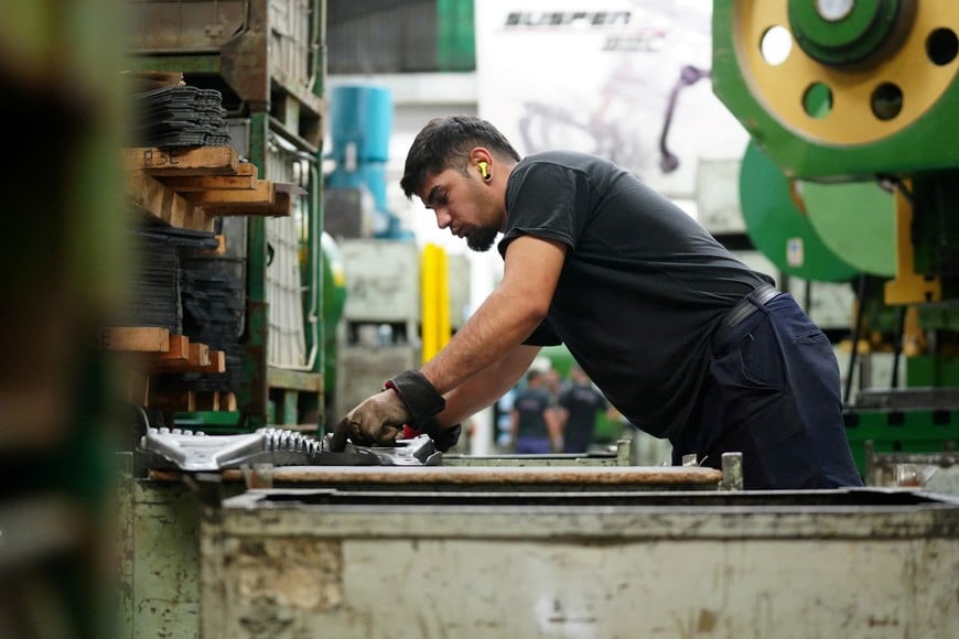 A man works at Suspenmec, a small and medium-sized auto parts company which produces control arms for car suspensions and supplies used-car repair shops, in Sarandi, on the outskirts of Buenos Aires, Argentina, April 17, 2026. REUTERS/Irina Dambrauskas
