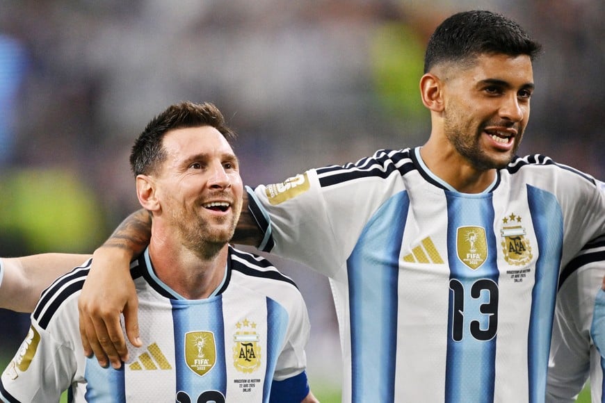 Soccer Football - FIFA World Cup 2026 - Group J - Argentina v Austria - Dallas Stadium, Arlington, Texas, U.S. - June 22, 2026
Argentina's Lionel Messi and Cristian Romero celebrate after the match IMAGN IMAGES via Reuters/Jerome Miron