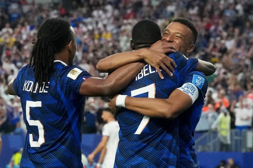 Soccer Football - FIFA World Cup 2026 - Group I - France v Iraq - Philadelphia Stadium, Philadelphia, Pennsylvania, U.S. - June 22, 2026
France's Ousmane Dembele celebrates scoring their third goal with Jules Kounde and Kylian Mbappe IMAGN IMAGES via Reuters/James Lang