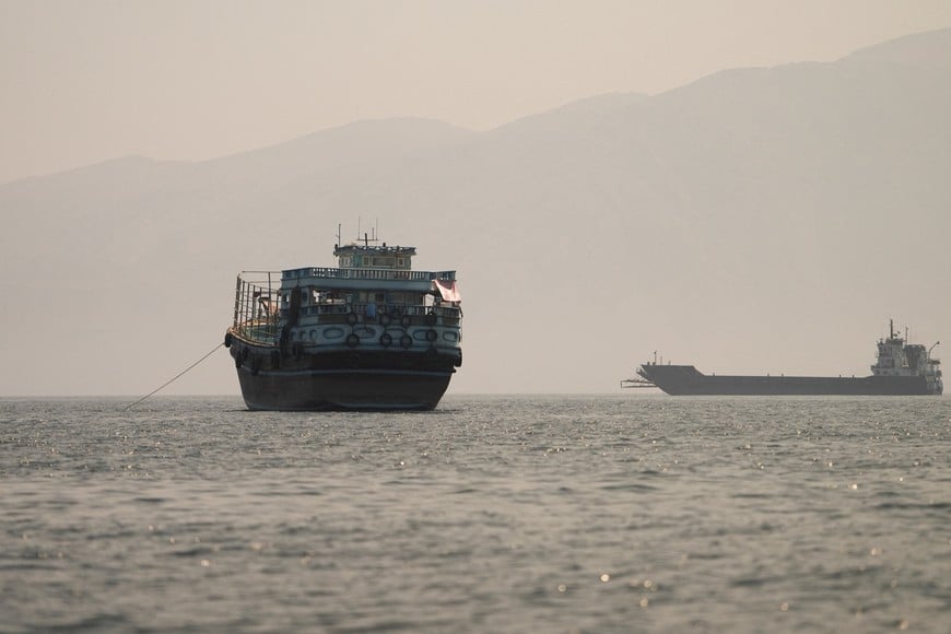 FILE PHOTO: Vessels at the Strait of Hormuz, as seen from Musandam, Oman, June 22, 2026. REUTERS/Stringer/File Photo